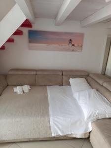Postel nebo postele na pokoji v ubytování Enjoy Trani