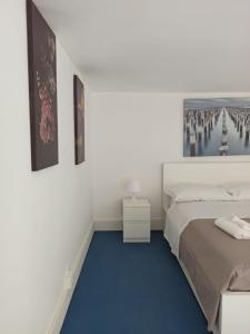 Postel nebo postele na pokoji v ubytování Enjoy Trani