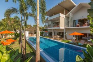 an image of a villa with a swimming pool and palm trees at Sea&Sky Beach Resort Beachfront Bungalows & Pool Villas in Mae Nam