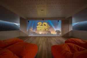 a room with a anniversary show on a stage at Sea&Sky Beach Resort Beachfront Bungalows & Pool Villas in Mae Nam
