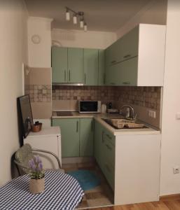 Η κουζίνα ή μικρή κουζίνα στο New Central Apartments