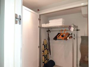 a closet with a white door and a shelf at Centralissimo grazioso monolocale in Turin