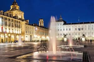 a group of fountains in front of a building at Centralissimo grazioso monolocale in Turin