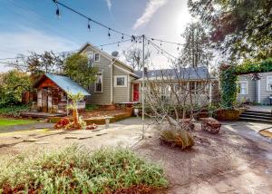 a home with a yard with a house at Forbestown Carriage House in Lakeport