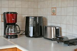two appliances sitting on a counter in a kitchen at Margarita's House in Hydra