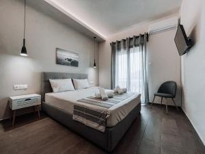 Postel nebo postele na pokoji v ubytování Hotel Eleni