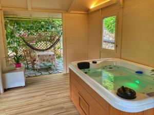 a jacuzzi tub in a room with a patio at La casa di Elda in Sanremo