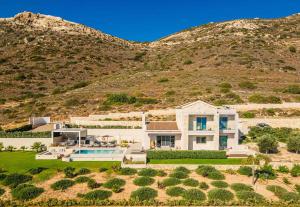 an aerial view of a house with a mountain at Cielo e Mare Villas in Falasarna