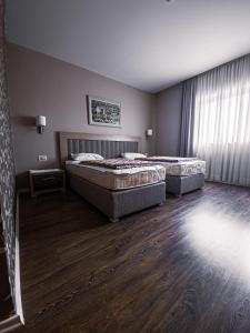 Katil atau katil-katil dalam bilik di Hotel Laudato