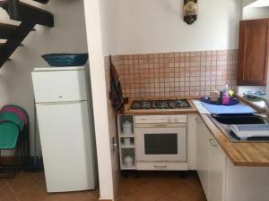 Kuchyň nebo kuchyňský kout v ubytování Appartamenti Il Capomandro