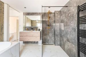 a bathroom with a shower and a sink at Logement viphouse Valkenburg in Valkenburg