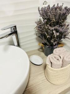 a bathroom counter with a sink and a towel at Casa InCentro in Pescara