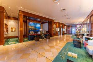 Uma área de estar em Beau Rivage Hotel
