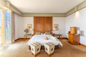 Uma cama ou camas num quarto em Beau Rivage Hotel
