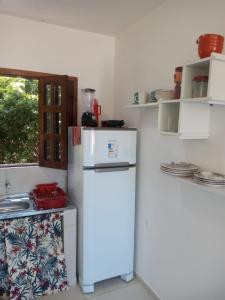 a kitchen with two refrigerators and a stove at VILA ACONCHEGO GAMELEIRA in Pipa