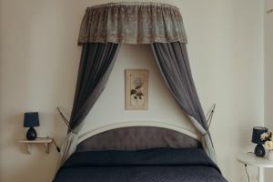 En eller flere senge i et værelse på La Dolce Vita