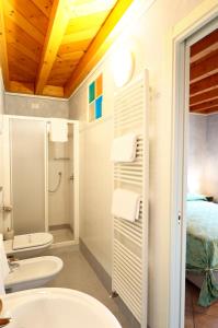 a bathroom with a sink and a toilet at Affittacamere Residenza Del Duca in Solferino