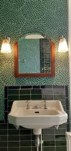 a bathroom with a sink and a mirror at Maison blanche in Cherval +32 photos
