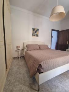 a bedroom with a large bed in a room at Simon's Home in Santo Stefano di Magra