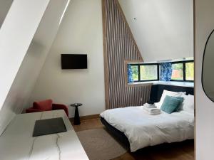 Ένα ή περισσότερα κρεβάτια σε δωμάτιο στο Finger Lakes Treehouse
