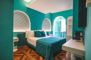 Postel nebo postele na pokoji v ubytování Cafè Latino Suites