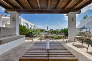 a patio with chairs and a water fountain at Villas Guzman - San Vicente in Moraira