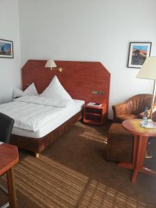 Postel nebo postele na pokoji v ubytování Hotel Quellenhof