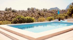 a swimming pool with a view of a mountain at VIP Alfaz del Pi in Alfaz del Pi