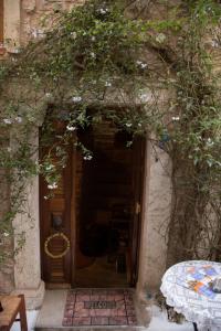 an entrance to a building with a door with areath at The Pounti in Pyrgi