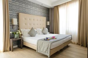 Łóżko lub łóżka w pokoju w obiekcie Windsor Hotel Milano