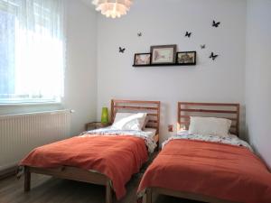 Postel nebo postele na pokoji v ubytování Two Flowers Apartments