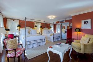 a bedroom with two beds and a living room at Saybrook Point Resort & Marina in Old Saybrook +34 photos