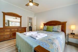 a bedroom with a bed with two towels on it at North Carolina Home Near Mountain Biking and Fishing in Pisgah Forest
