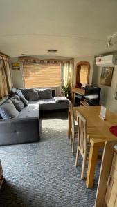 a living room with a couch and a table at Riviera Zator in Zator