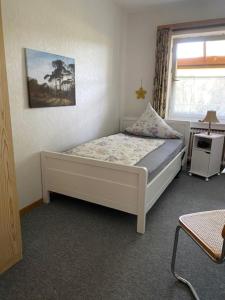 Postel nebo postele na pokoji v ubytování Ferienwohnung Wegener