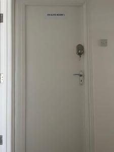 a door with a sign that reads the safe room at Inviting 2-Bed Apartment in Ilford in Ilford