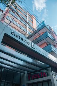 a building with a sign on the side of it at Distrito A FMA-Coliving in Salta