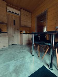 a dining room with a table and some chairs at Agroturystyka Rancho Łęg in Kruszyna