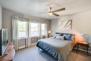 a bedroom with a bed and a ceiling fan at Luxury Denver Area Townhome with Rooftop Deck! in Englewood