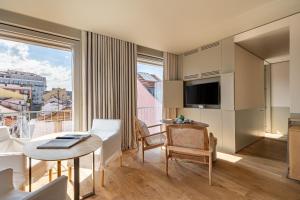 a hotel room with a view of a city at Verride Palácio Santa Catarina in Lisbon