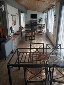a living room with a table and some chairs at B&B Ca' d'Andrea in San Martino