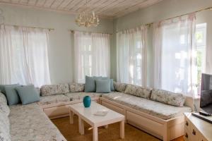 a living room with a couch and a table at The Dream in Kastoria