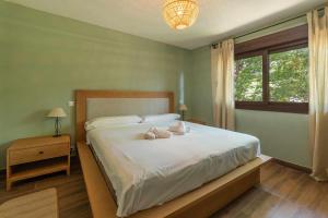Ένα ή περισσότερα κρεβάτια σε δωμάτιο στο Casa Vacacional Deva