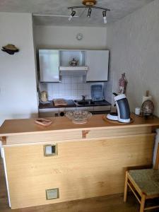 a kitchen with a counter with a coffee maker on it at Studio Gil La Bresse Hohneck in La Bresse