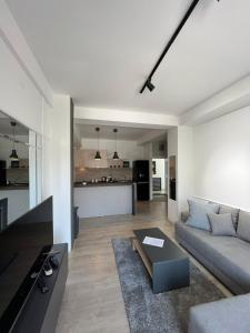 a living room with a couch and a table at Apartments IVI Gevgelija in Gevgelija
