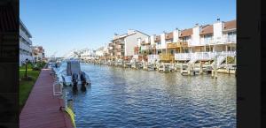 a view of a river with buildings and a dock at Spacious 2 Bedroom and 2 Baths in Ocean City