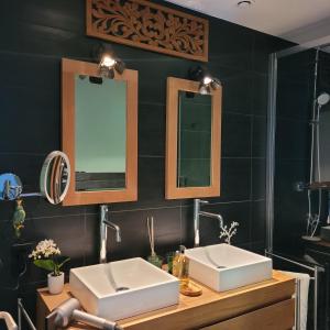 a bathroom with two sinks and two mirrors at LA VILLA MARIE in Richebourg +21 photos