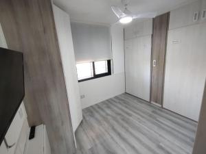 an empty room with a door and a window at Ático con acceso directo al mar in Miami Platja