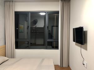 Televisyen dan/atau pusat hiburan di Tít Mít HomeStay