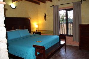 Postel nebo postele na pokoji v ubytování Hotel Casa Caro
